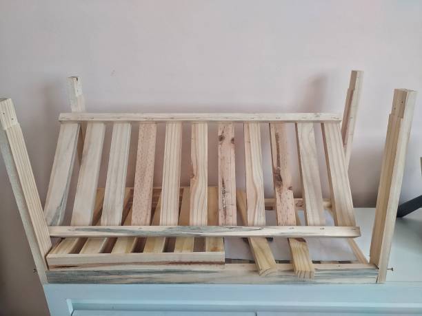 istock Dismantled shoe rack shot against a peach-colored wall 1392824452