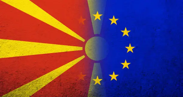 Photo of Flag of the European Union with Macedonia National flag. Grunge background
