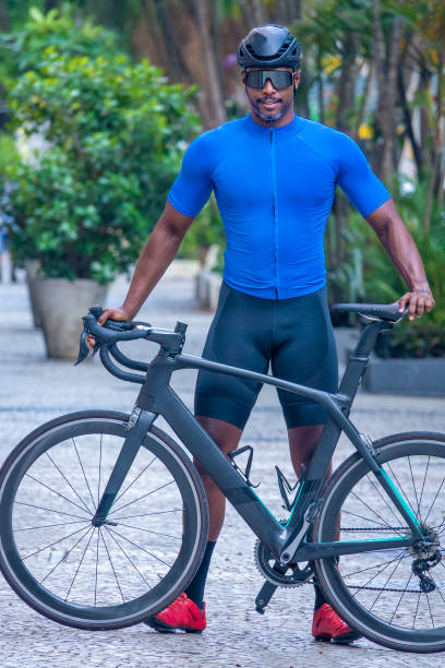 istock Cycling athlete poses with her bike 1392827292