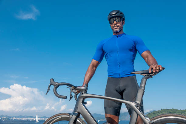 istock Athlete poses with his bicycle 1392827415