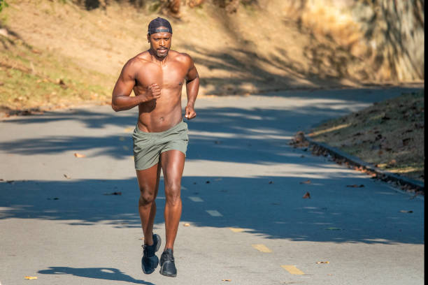 istock Athlete running in the park 1392827490