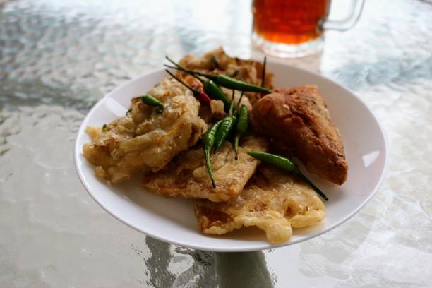 istock Gorengan or fried snacks on a white plate. 1392829392