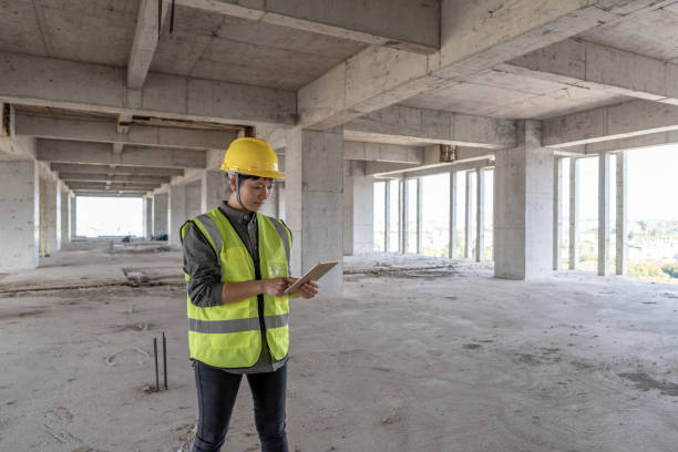 istock A female construction engineer looks at a tablet in an unfinished building 1392841390