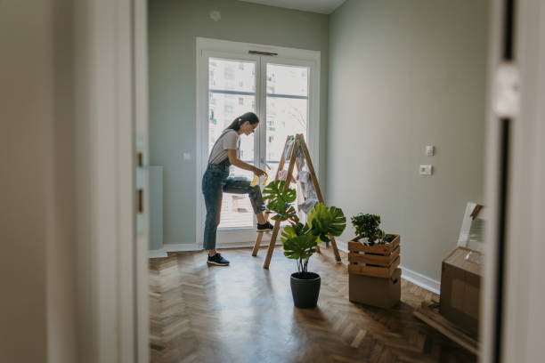 istock Woman in her new home 1392843153