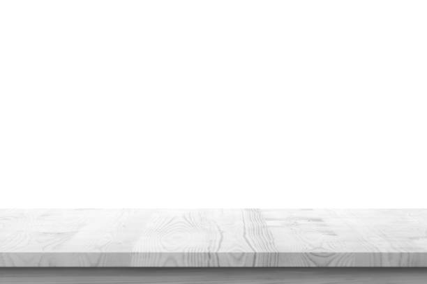 istock Empty white wooden table top isolated on white background 1392847054