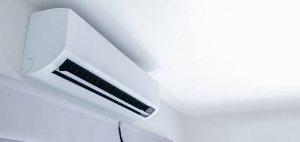 istock Air conditioner on white wall room interior background 1392847780