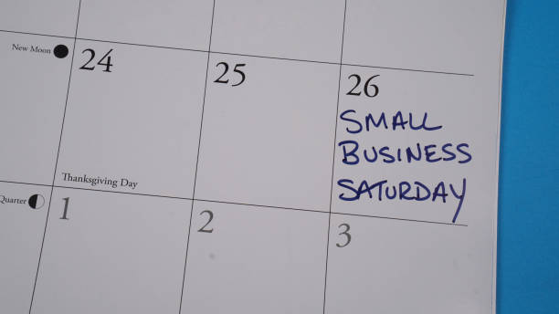 Small Business Saturday on Calendar Small Business Saturday written on a calendar on November 26, 2022 small business saturday stock pictures, royalty-free photos & images