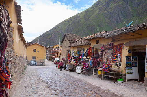 Ollantaytambo, Peru, April 2022: Street in  Ollantaytambo, a village in the Sacred Valley, Peru, known for its Inca ruins.
