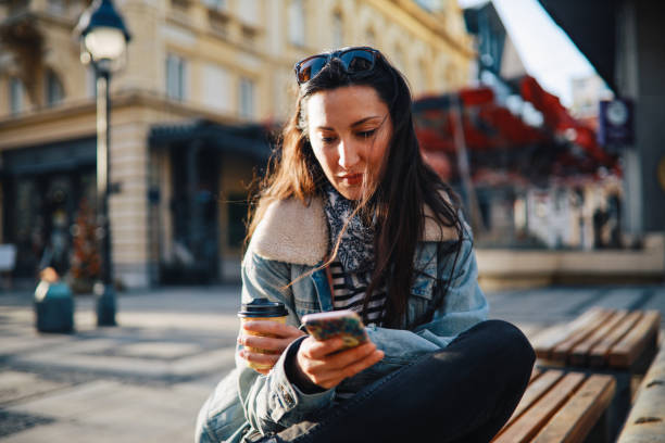 istock woman having a coffee break in the city 1392852899