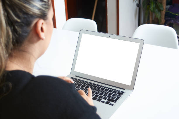 istock Young woman working on a laptop computer 1392861615