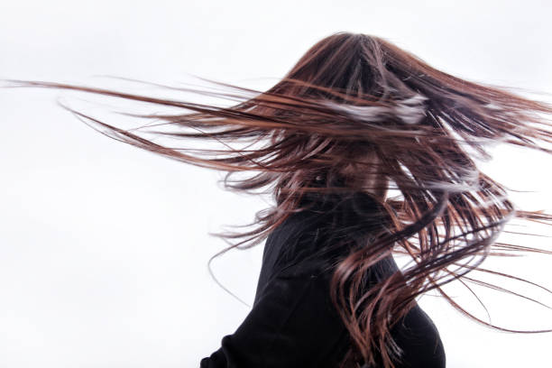 istock Long hair young woman dancing 1392863790