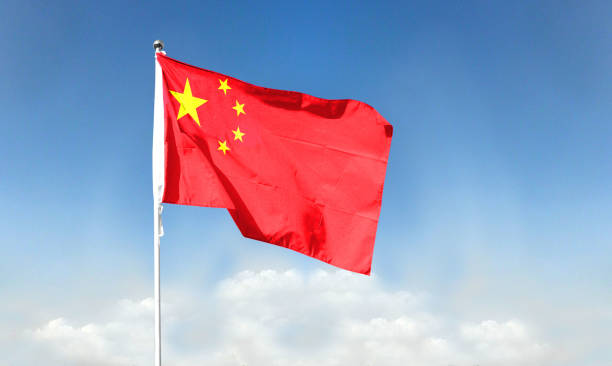 istock Chinese flag with blue sky. waving blue sky 1392866568