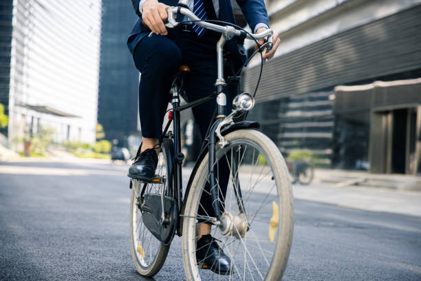 istock businessman riding on a bicycle 1392867359