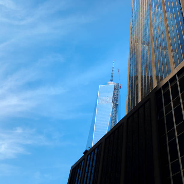 istock Low angle cityscape with skyscrapers over blue sky 1392868321