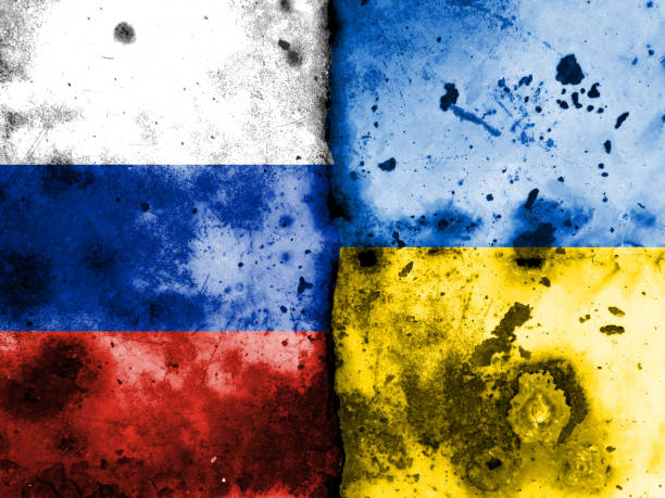 istock Russian flag and Ukrainian flag 1392869361