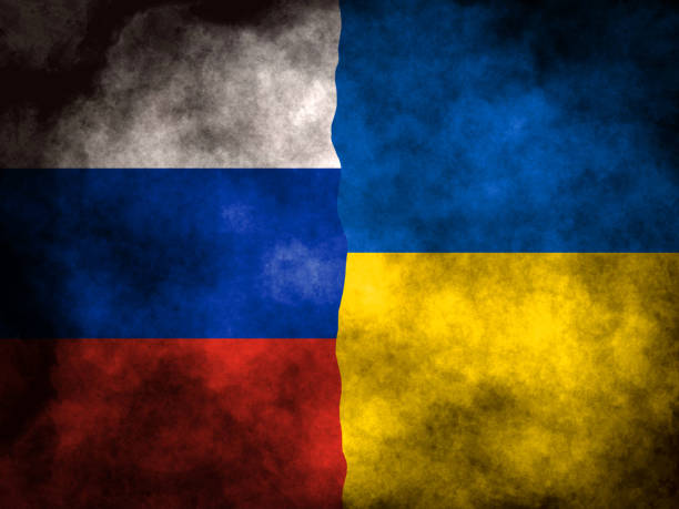 istock Russian flag and Ukrainian flag 1392869431