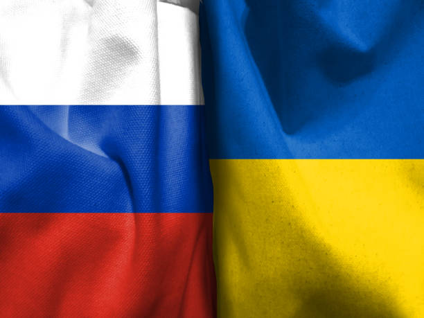 istock Russian flag and Ukrainian flag 1392869504