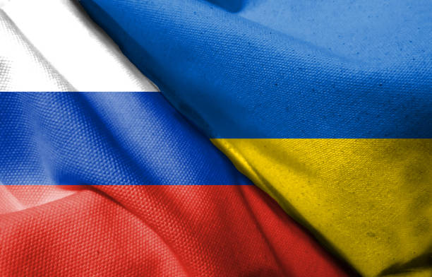istock Russian flag and Ukrainian flag 1392870926