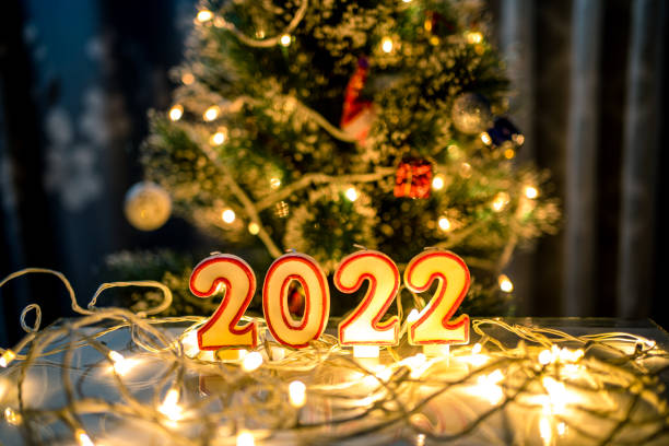 istock burning candle light during new Christmas evening 1392871135