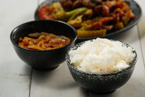 Chinese food on the white wood table