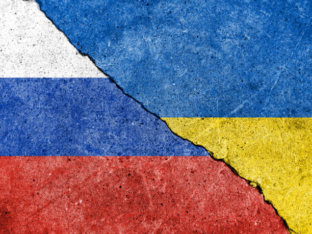 istock Russian flag and Ukrainian flag 1392872062