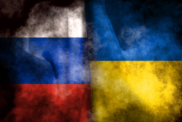 istock Russian flag and Ukrainian flag 1392873315