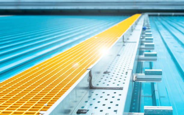 istock Ground Bonding for Aluminium cable tray.Cable connected to electrical ground bar for safety.The ground wire between the cable Cable Ladder install at outdoor metal roofing 1392876936