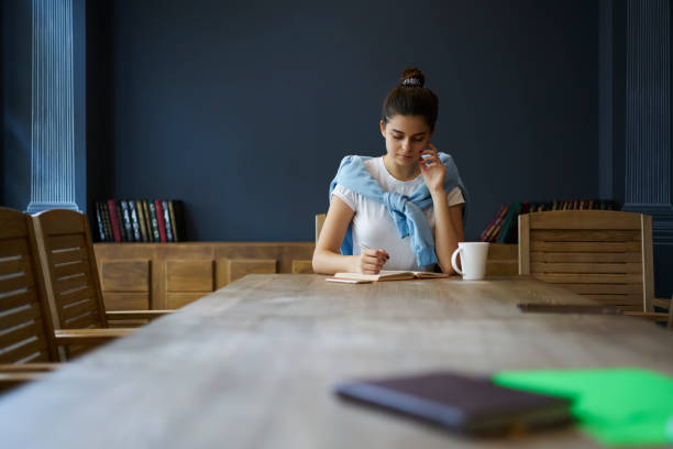 istock Girl sitting 1392882347