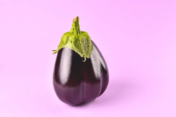 istock Eggplant on a purple background, fresh juicy vegetable on a colored background, selective focus 1392883088