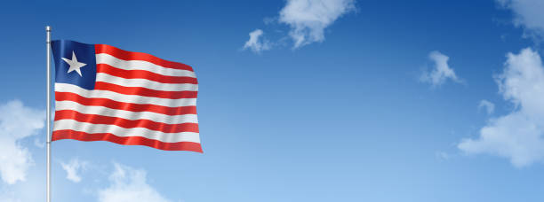 istock Liberian flag isolated on a blue sky. Horizontal banner 1392887428