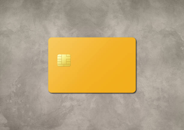 istock Yellow credit card on a concrete background 1392888035