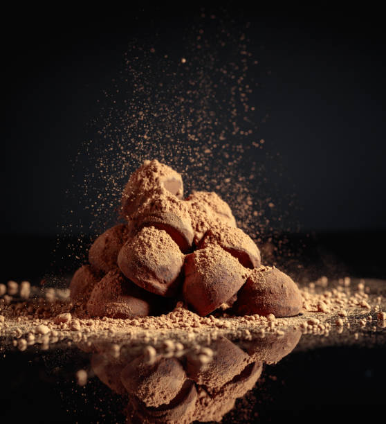 istock Chocolate truffles sprinkled with cocoa. 1392888156