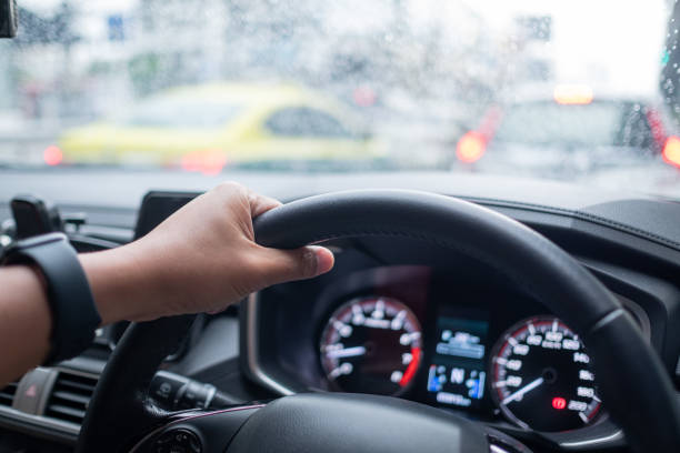 istock hand on steering wheel, driver, travel on holiday 1392888245