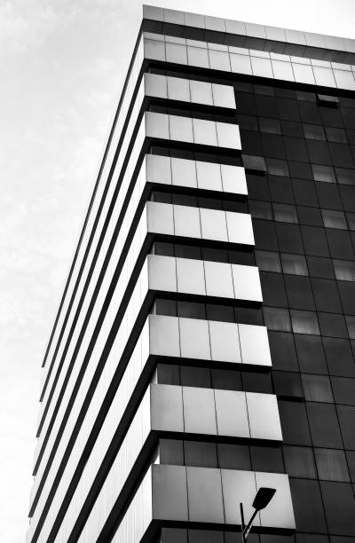 istock Geometric facade with black glass windows 1392889335