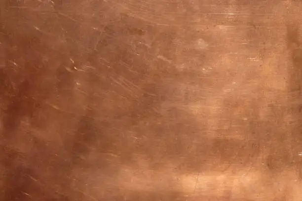 Photo of Copper surface with sunlight. Copy space.