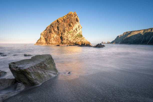 istock Curious rock with a diagonal vein of quartz 1392890442