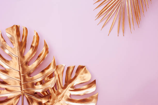 istock Creative nature layout made of tropical gold leaves. 1392893479