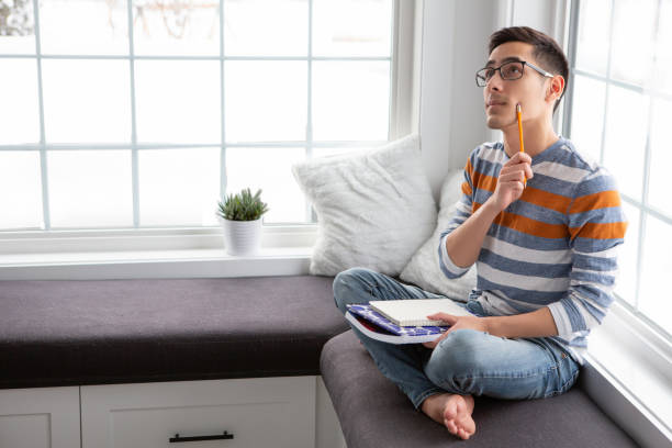 istock Mixed race young adult student thinking 1392893495