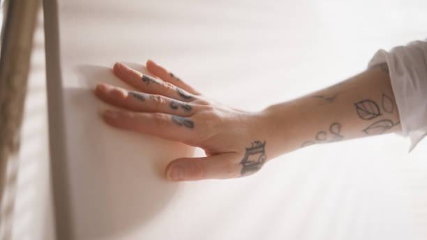 istock An artist stroking a blank canvas 1392896396