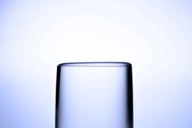 Extreme close-up of water about to overflow from a drinking glass.
Surface Tension