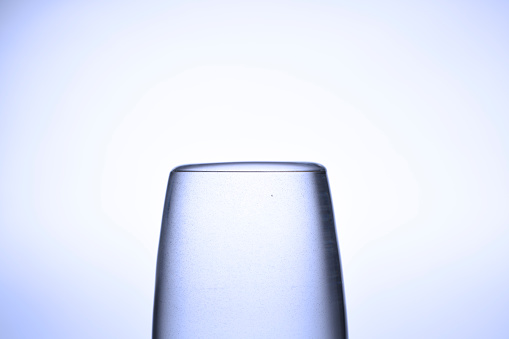 Extreme close-up of water about to overflow from a drinking glass.
Surface Tension