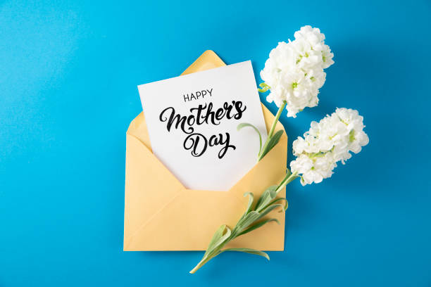 istock White Flowers with White Greeting Card in Yellow Envelope 1392900544