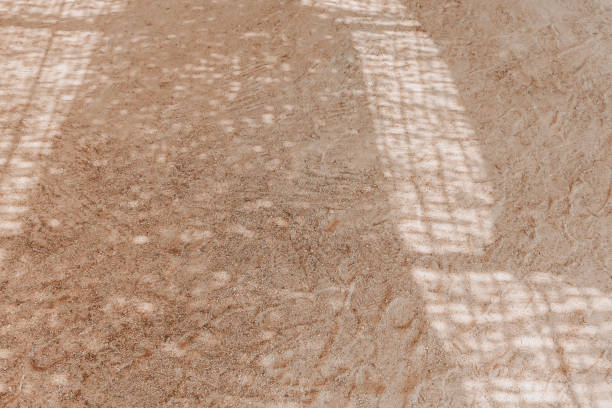 istock Geometric shadows on the sand. Abstract shades. Sandy beach texture background, summer concept. 1392901913
