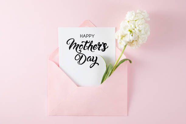 istock White Flowers with White Greeting Card in Pink Envelope 1392902132
