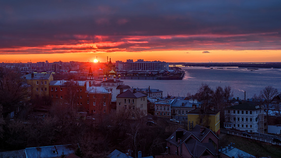 Cityscape of historical centre of Nizhny Novgorod after sunset. Beautiful colours of clouds illuminated by sun.