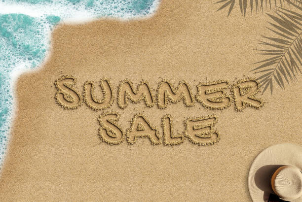 istock Summer sale text on sandy beach, e-commerce summer campaign concept, summer sale banner idea, palm shadow sea wave and straw hat composition, top view 1392902547