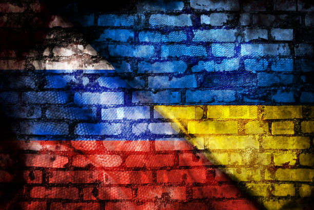 istock Russian flag and Ukrainian flag 1392903275