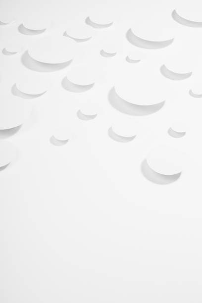 istock White simple geometric background with flying ovals in hard light with strict light grey shadows, border, copy space, vertical, top view. Futuristic soft airy minimal backdrop for advertising, design. 1392903279