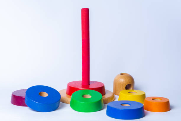 istock wooden pyramid tower of rainbow blocks, scattered around 1392903407