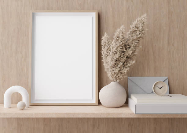 istock Empty vertical picture frame standing on shelve in modern room. Mock up interior in contemporary style. Free, copy space for picture. Pampas grass in vase. 3D rendering. 1392903580